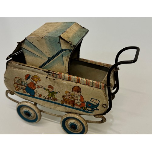 288 - Toys, lithographed tin plate German pram..

This lot is available for in-house shipping