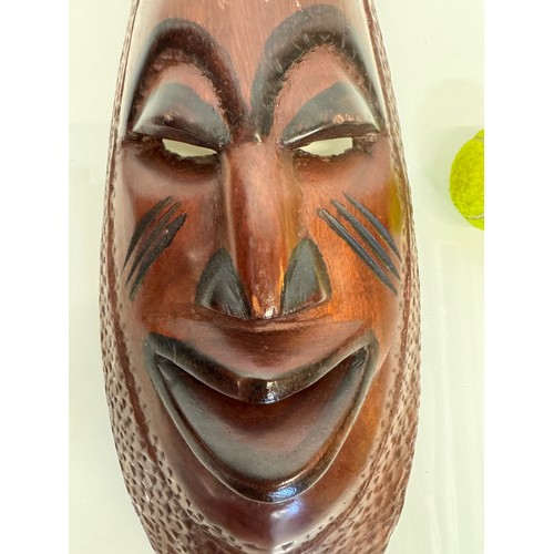 37 - Hand carved tribal art, wall hanging face mask 61 cm tall.

This lot is available for in-house shipp... 