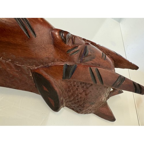 37 - Hand carved tribal art, wall hanging face mask 61 cm tall.

This lot is available for in-house shipp... 