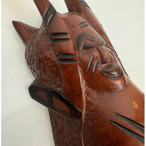 37 - Hand carved tribal art, wall hanging face mask 61 cm tall.

This lot is available for in-house shipp... 