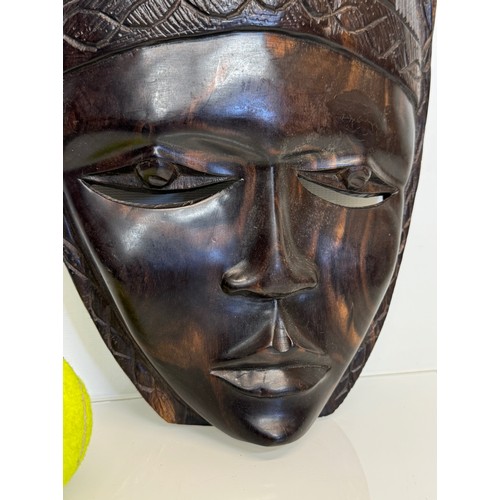 38 - Hand carved African tribal art wall mask 38 cm high.

This lot is available for in-house shipping