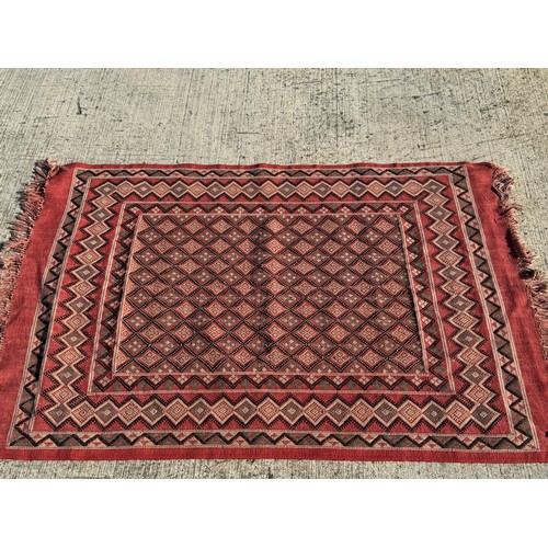 40 - Furnishings, a Hand Woven floor rug, 120 cm x 190 cm.

This lot is available for in-house shipping