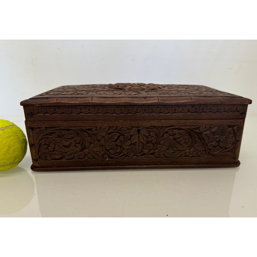 82 - Carved wooden box, with hand craved floral and leaf designs to the top and four sides. 28 cm x 18 cm... 