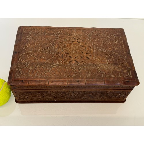 82 - Carved wooden box, with hand craved floral and leaf designs to the top and four sides. 28 cm x 18 cm... 