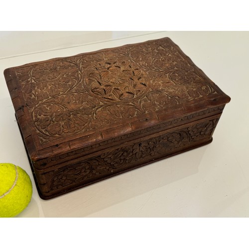 82 - Carved wooden box, with hand craved floral and leaf designs to the top and four sides. 28 cm x 18 cm... 