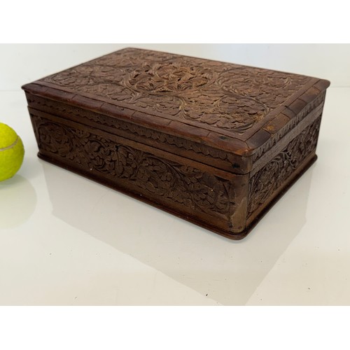 82 - Carved wooden box, with hand craved floral and leaf designs to the top and four sides. 28 cm x 18 cm... 