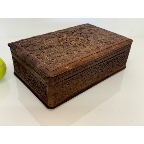 82 - Carved wooden box, with hand craved floral and leaf designs to the top and four sides. 28 cm x 18 cm... 