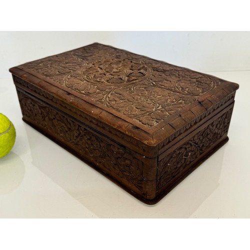 82 - Carved wooden box, with hand craved floral and leaf designs to the top and four sides. 28 cm x 18 cm... 