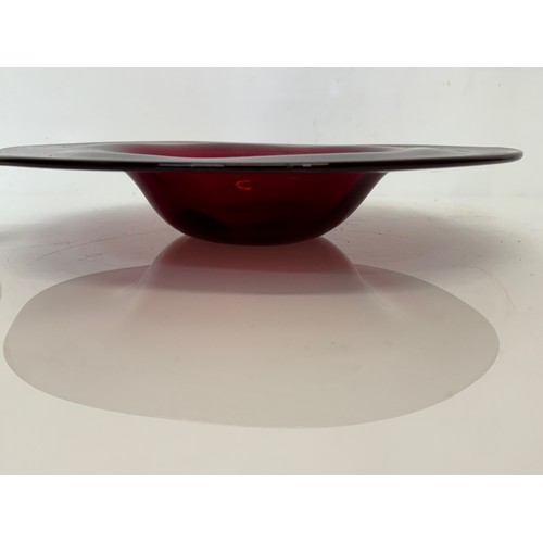 88 - A large dark red coloured art glass bowl 34 cm in diameter.

This lot is available for in-house ship... 