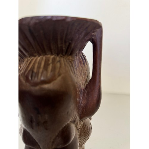 388 - Tribal art candle stand, hand carved north African hard wood stand, 25 cm tall.

This lot is availab... 