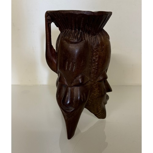 388 - Tribal art candle stand, hand carved north African hard wood stand, 25 cm tall.

This lot is availab... 