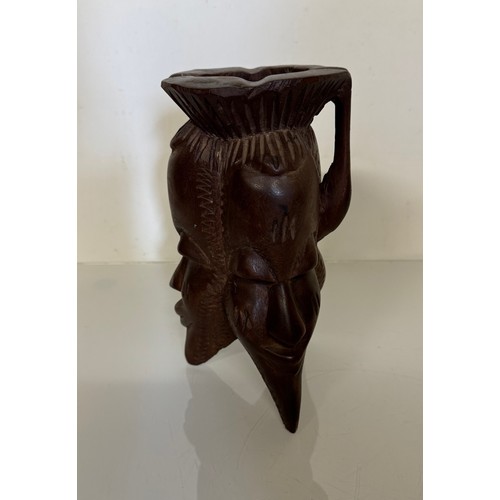 388 - Tribal art candle stand, hand carved north African hard wood stand, 25 cm tall.

This lot is availab... 