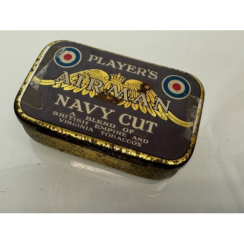 393 - Militaria, A vintage Players Navy cut tobacco tin and a military whistle by Hudson and Co Birmingham... 