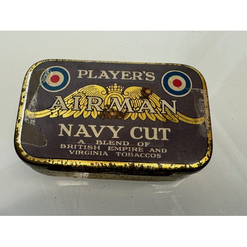 393 - Militaria, A vintage Players Navy cut tobacco tin and a military whistle by Hudson and Co Birmingham... 