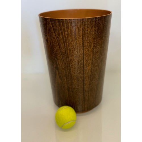 395 - Mid century furniture, a wood effect plastic bin. 22cm diameter x 33 cm tall.

This lot is available... 