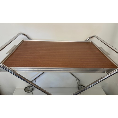 396 - Folding tea trolley, classic mid century furniture.

This lot is available for in-house shipping