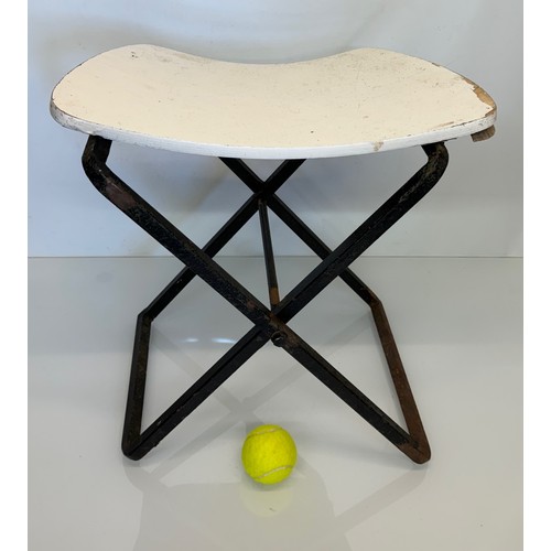 397 - Mid century furniture a folding stool with a shaped wooden seat on a steel frame.

This lot is avail... 