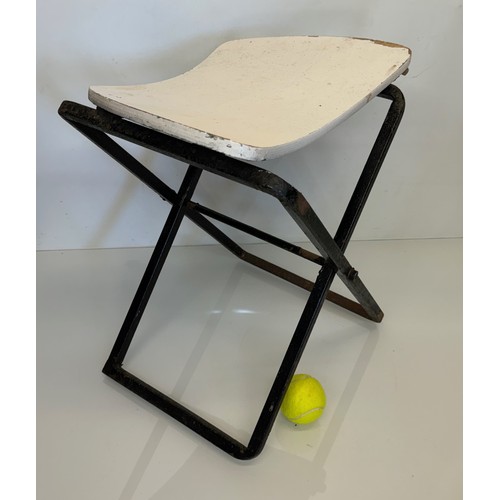 397 - Mid century furniture a folding stool with a shaped wooden seat on a steel frame.

This lot is avail... 