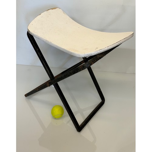 397 - Mid century furniture a folding stool with a shaped wooden seat on a steel frame.

This lot is avail... 