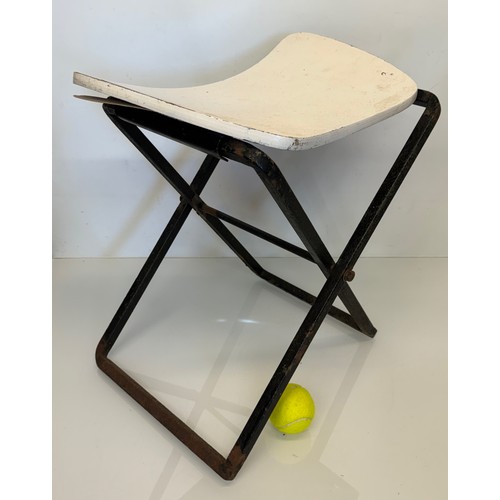 397 - Mid century furniture a folding stool with a shaped wooden seat on a steel frame.

This lot is avail... 