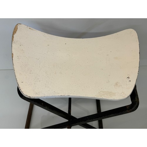 397 - Mid century furniture a folding stool with a shaped wooden seat on a steel frame.

This lot is avail... 