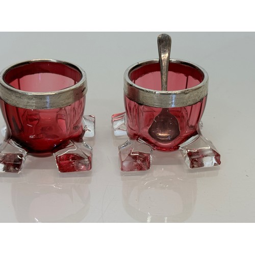 403 - Pair of ruby glass salts with indistinctly marked rims.

This lot is available for in-house shipping