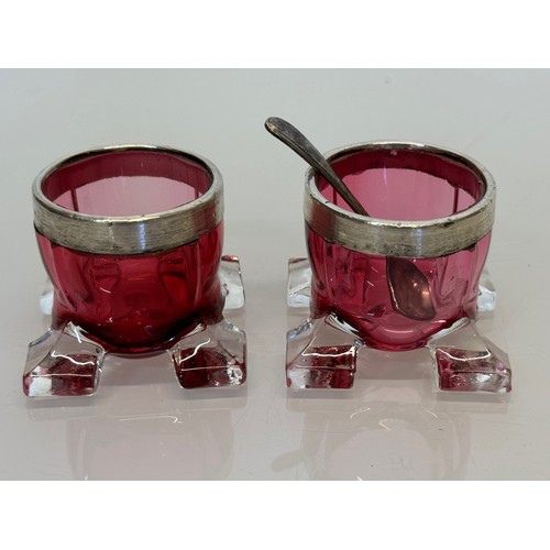 403 - Pair of ruby glass salts with indistinctly marked rims.

This lot is available for in-house shipping