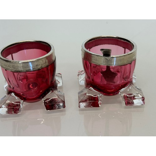 403 - Pair of ruby glass salts with indistinctly marked rims.

This lot is available for in-house shipping