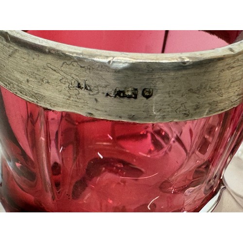 403 - Pair of ruby glass salts with indistinctly marked rims.

This lot is available for in-house shipping