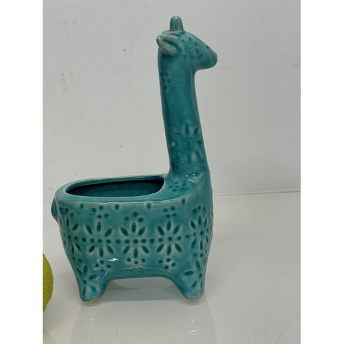 175 - Mid century studio pottery giraffe vase. 20 cm tall.

This lot is available for in-house shipping