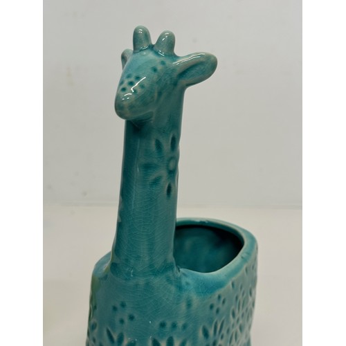 175 - Mid century studio pottery giraffe vase. 20 cm tall.

This lot is available for in-house shipping