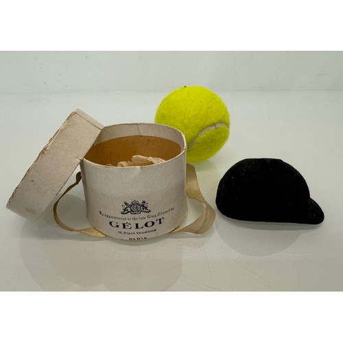 26 - A miniature Gelot of Paris branded riding hat 7 cm long in a hat box.

This lot is available for in-... 