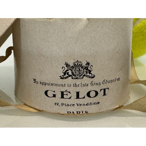 26 - A miniature Gelot of Paris branded riding hat 7 cm long in a hat box.

This lot is available for in-... 