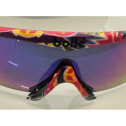 48 - Vintage ski wear, a cased pair of Bolle sunglasses, with alternative frame sections.

This lot is av... 