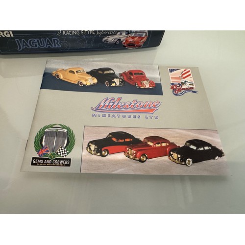 55 - Toys, die cast model cars, boxed, and catalogues, two jaguar E Type car sets and two catalogues.

Th... 