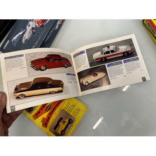 55 - Toys, die cast model cars, boxed, and catalogues, two jaguar E Type car sets and two catalogues.

Th... 