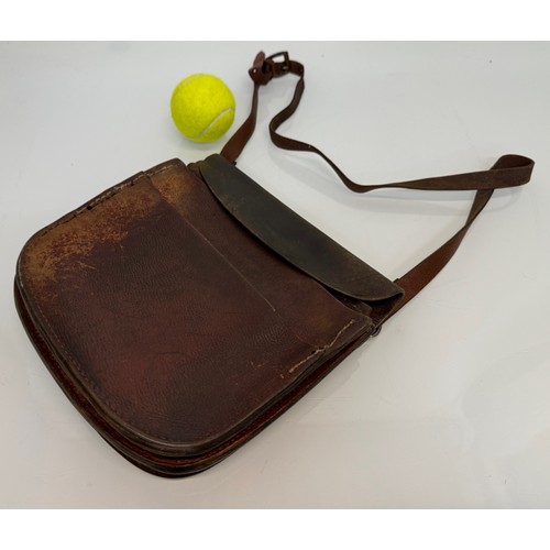 121 - Leather bag, a vintage market traders money bag, 23 cm x 24 cm.


This lot is available for in-house... 