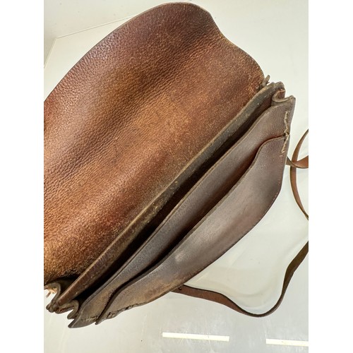 121 - Leather bag, a vintage market traders money bag, 23 cm x 24 cm.


This lot is available for in-house... 