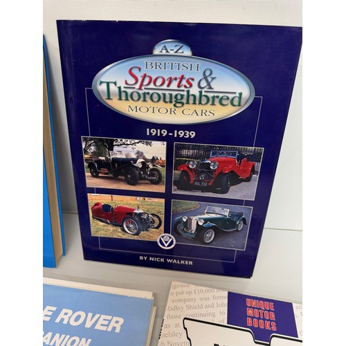 124 - Automobilia, books on Range Rovers and Land Rover Discovery and MG and more, a manual and a glass La... 