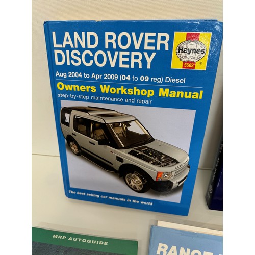 124 - Automobilia, books on Range Rovers and Land Rover Discovery and MG and more, a manual and a glass La... 