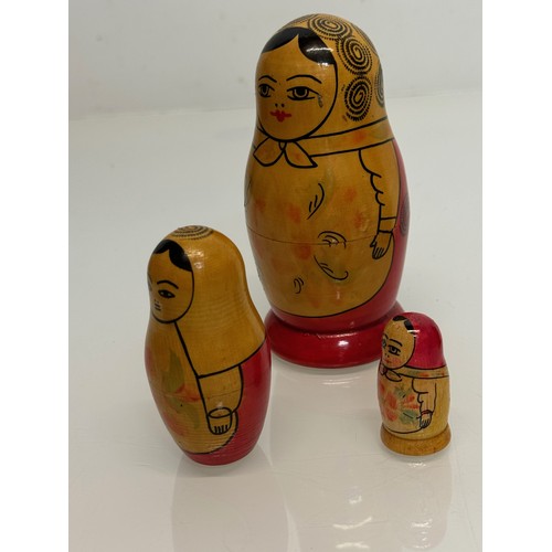 129 - Two wooden Russian Matryoshka stacking dolls.

This lot is available for in-house shipping