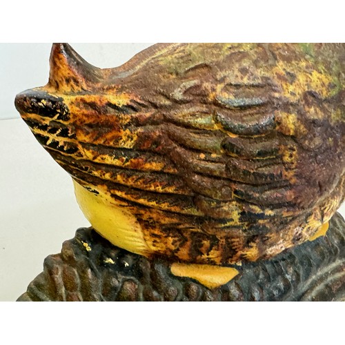 137 - An old cast iron door stop in the shape of a nesting duck. 17 cm wide x 20 cm tall.

This lot is ava... 