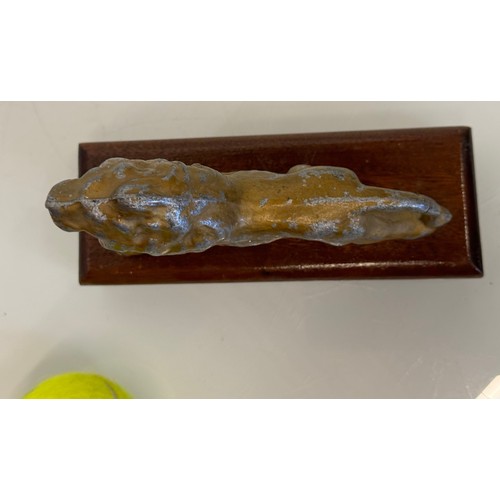 139 - A mounted cast figure of a Lion 18 cm long x 13 cm tall.

This lot is available for in-house shippin... 