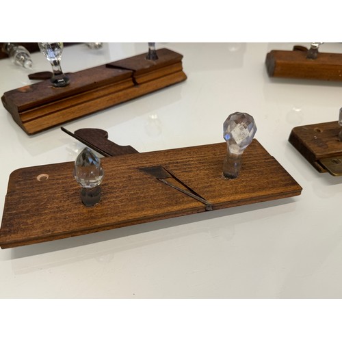 142 - Kitsch hanging rails, repurposed wooden block planes with glass hanging points, each individually mo... 