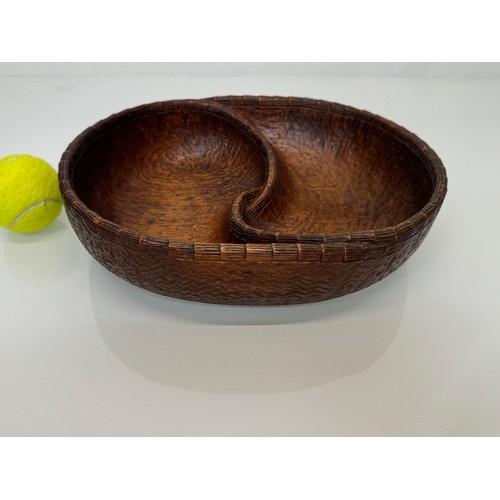 304 - Hand carved mid century wooden bowl of a yin and yang design, 31 cm x 25 cm x 7.5 cm.

This lot is a... 