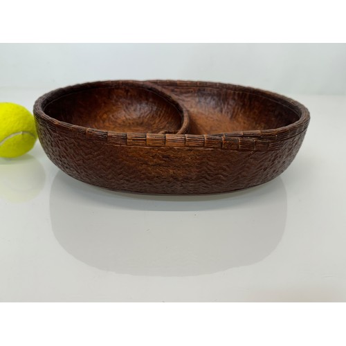 304 - Hand carved mid century wooden bowl of a yin and yang design, 31 cm x 25 cm x 7.5 cm.

This lot is a... 