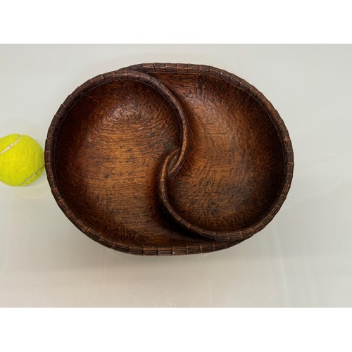 304 - Hand carved mid century wooden bowl of a yin and yang design, 31 cm x 25 cm x 7.5 cm.

This lot is a... 