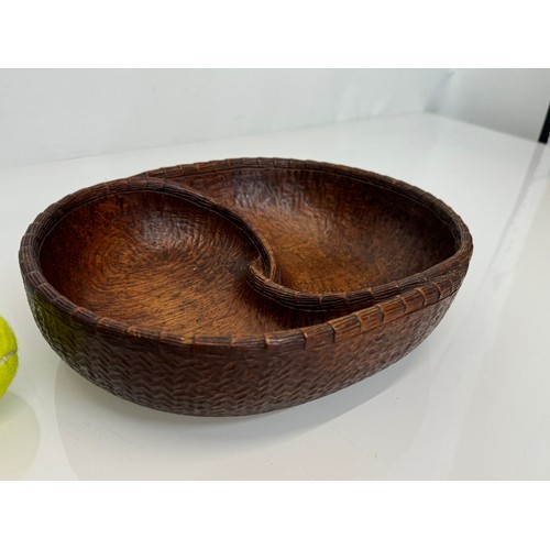 304 - Hand carved mid century wooden bowl of a yin and yang design, 31 cm x 25 cm x 7.5 cm.

This lot is a... 