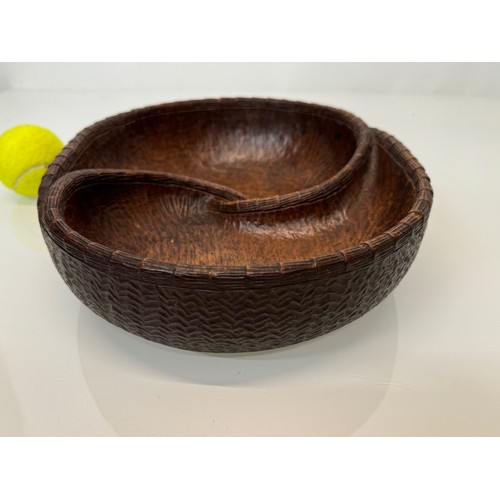 304 - Hand carved mid century wooden bowl of a yin and yang design, 31 cm x 25 cm x 7.5 cm.

This lot is a... 