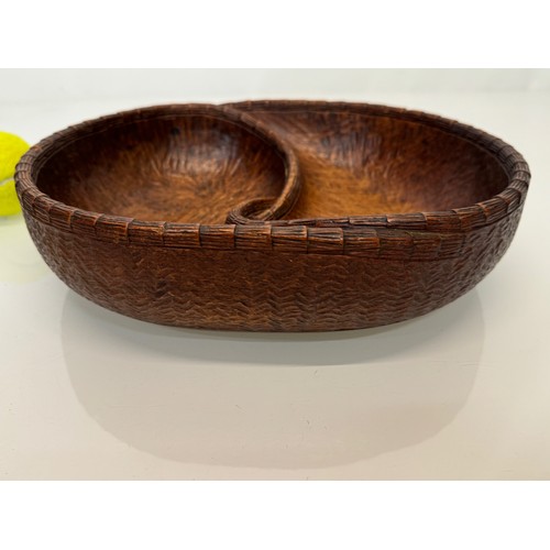 304 - Hand carved mid century wooden bowl of a yin and yang design, 31 cm x 25 cm x 7.5 cm.

This lot is a... 